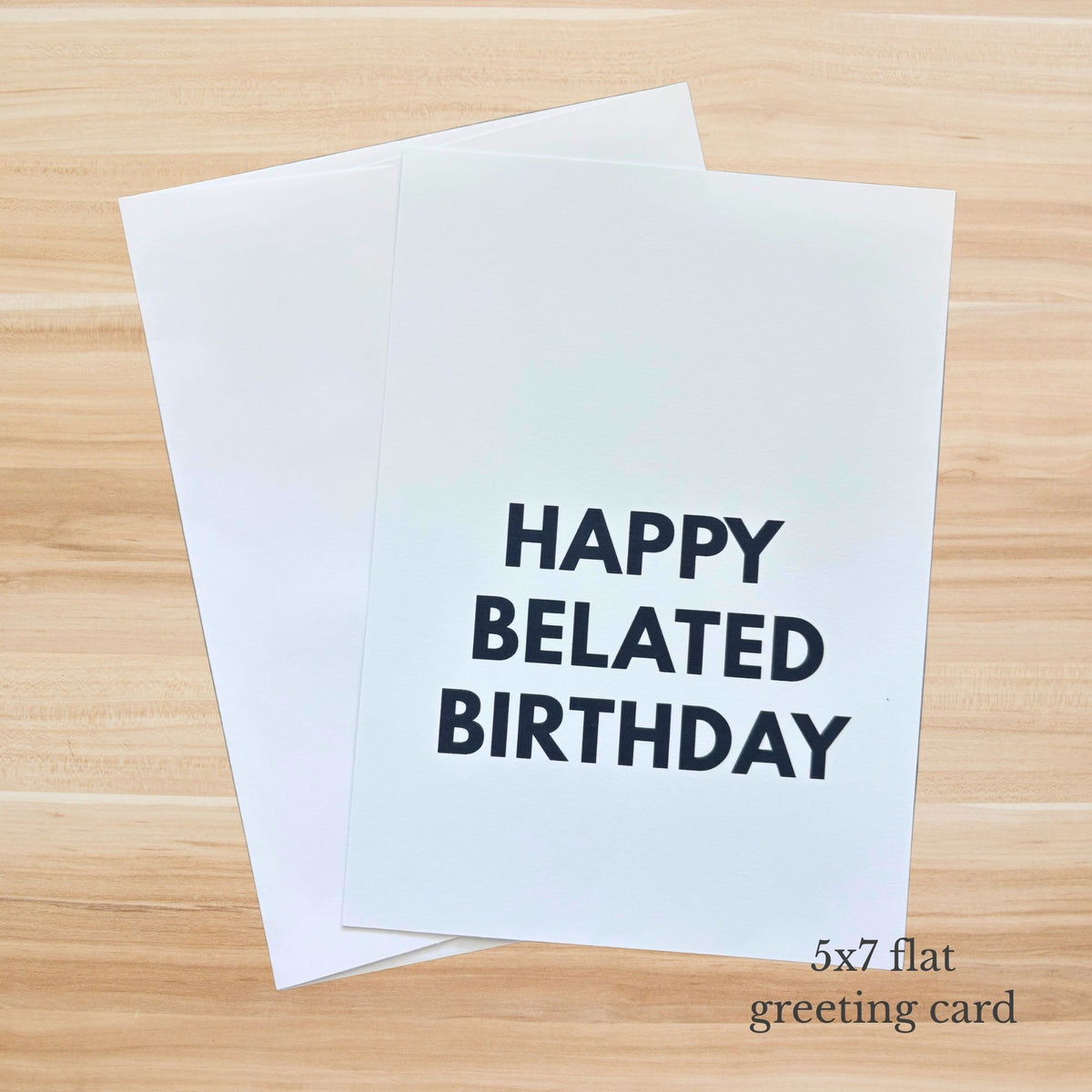 Minimal belated birthday card with bold black Happy Belated Birthday text on a white background