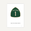 Green road sign with 'California 1' on a white background