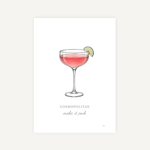 A minimalist art print featuring a watercolor-style illustration of a pink cocktail in a coupe glass with a lime wedge garnish. Below the illustration, the text reads 'COSMOPOLITAN make it pink' in a clean serif and script font.