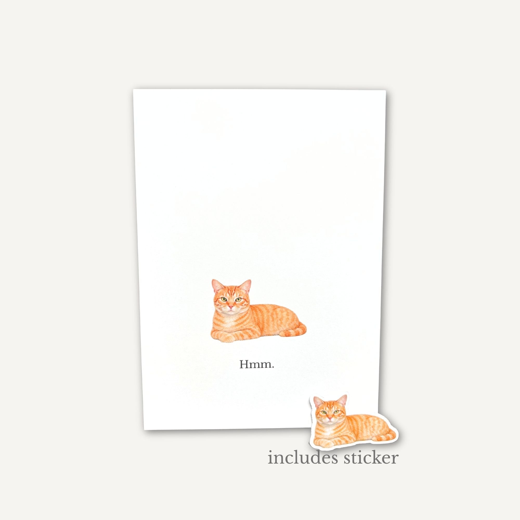 Note card with a cat illustration and a matching sticker on a white background