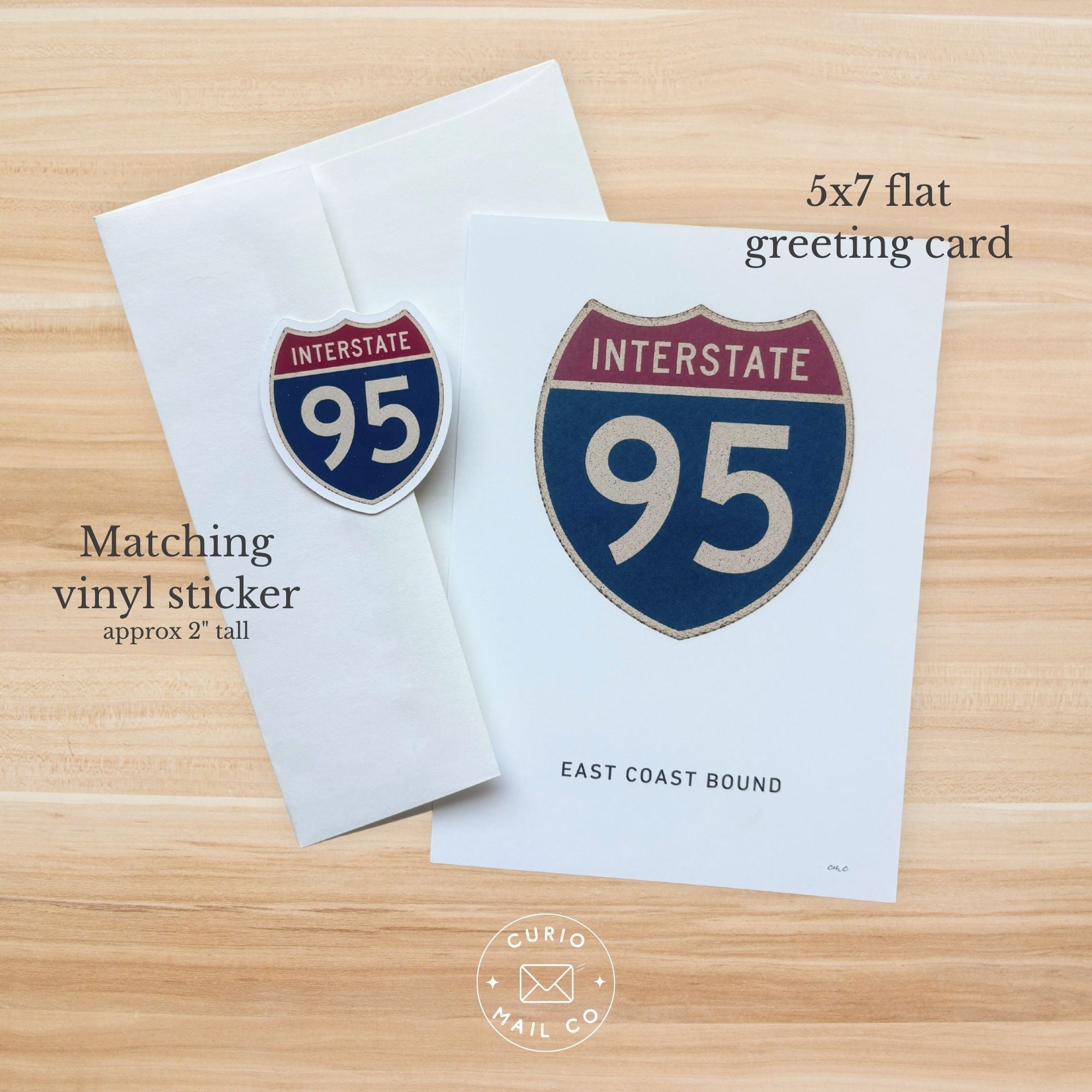 5x7 flat greeting card and matching vinyl sticker with Interstate 95 design on a wooden surface.