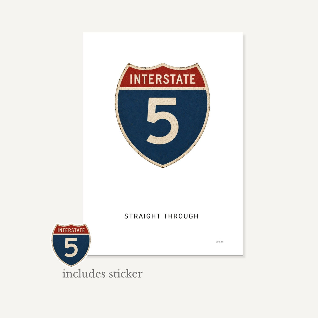 Interstate 5 sign with a sticker on a white background