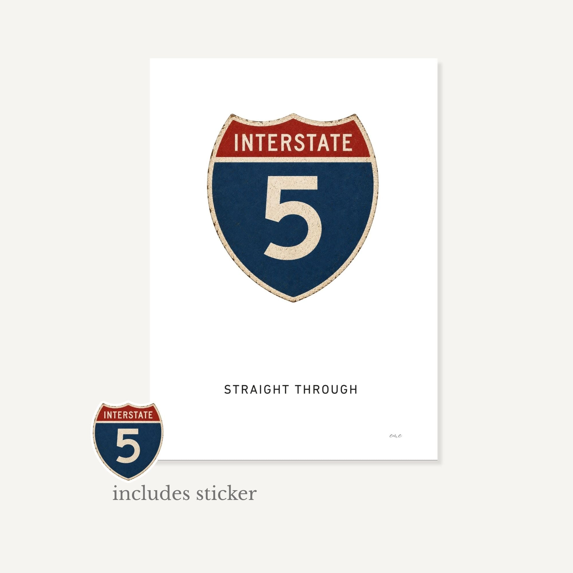 Interstate 5 sign with a sticker on a white background