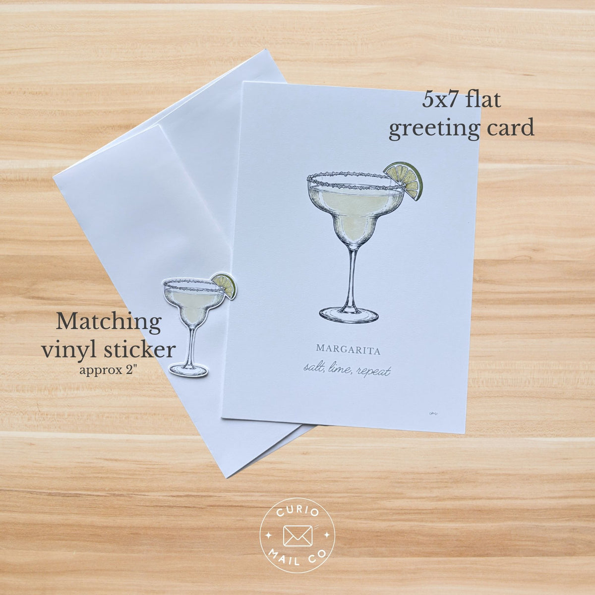 A 5x7 flat greeting card with a cocktail illustration and the text 'Margarita with love, repeat!' shown on a light wood background, alongside a matching vinyl sticker and overlaid size/text labels.