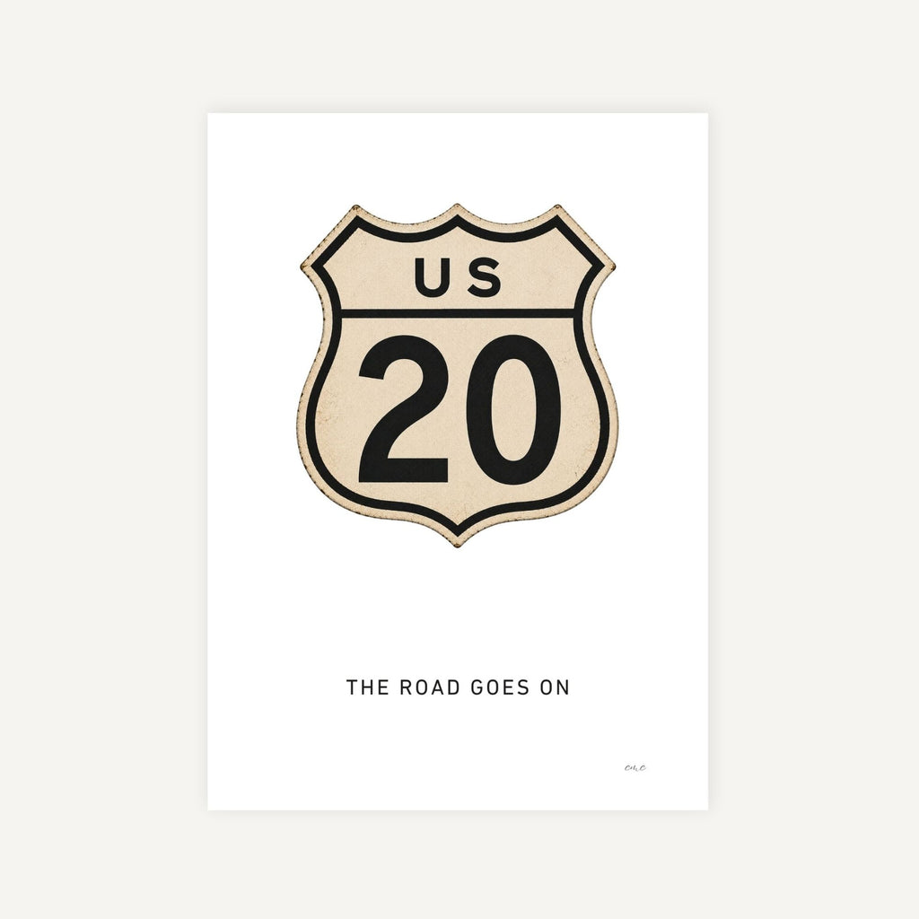 Vintage-style US Route 20 sign with 'The Road Goes On' text on a white background