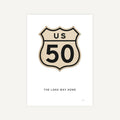 Vintage-style US Route 50 sign with 'The Long Way Home' text on a white background