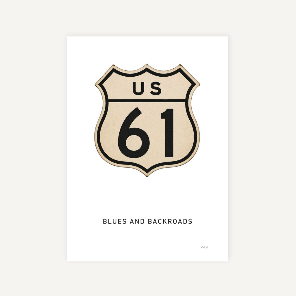 US Route 61 sign with 'Blues and Backroads' text on a white background