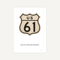 US Route 61 sign with 'Blues and Backroads' text on a white background
