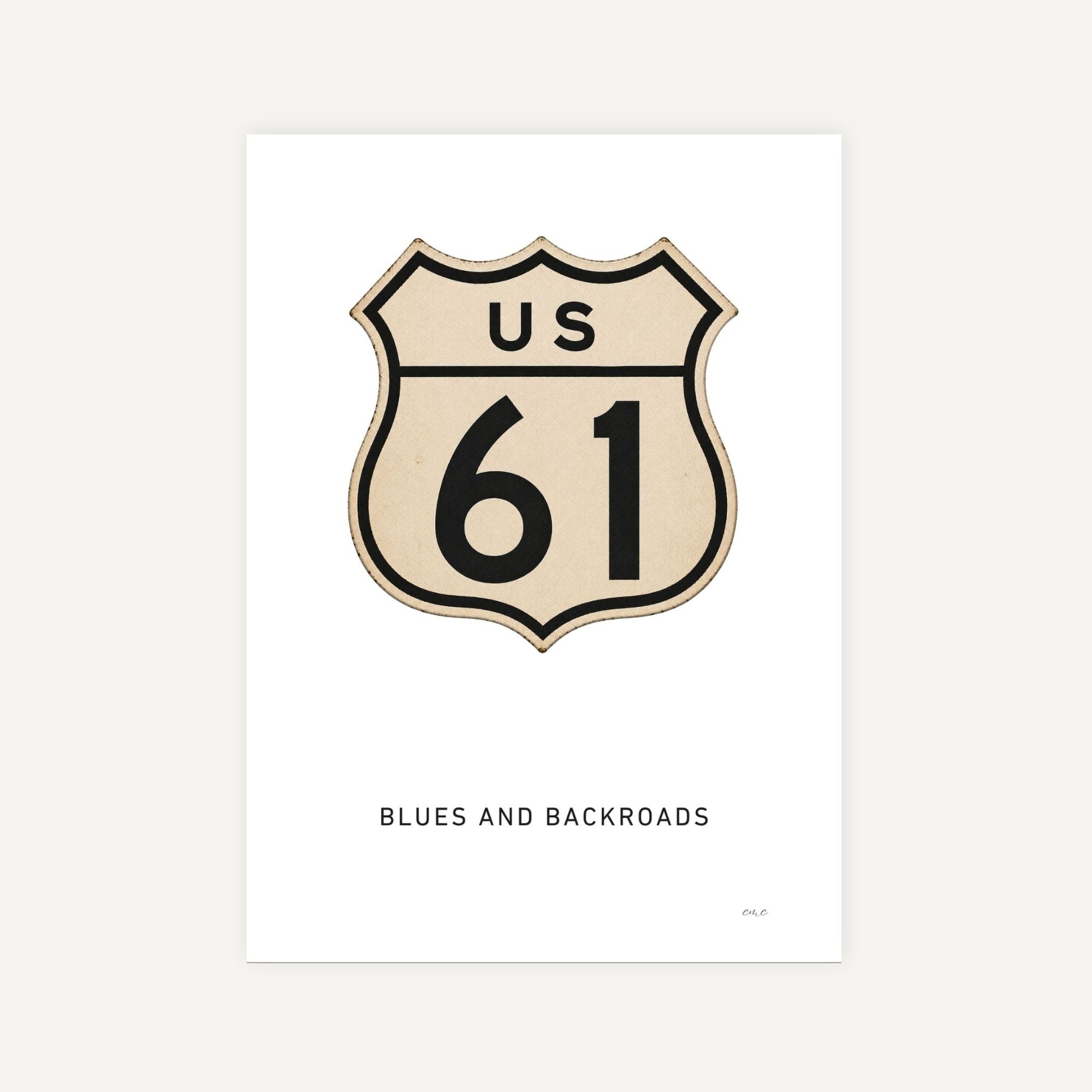 US Route 61 sign with 'Blues and Backroads' text on a white background