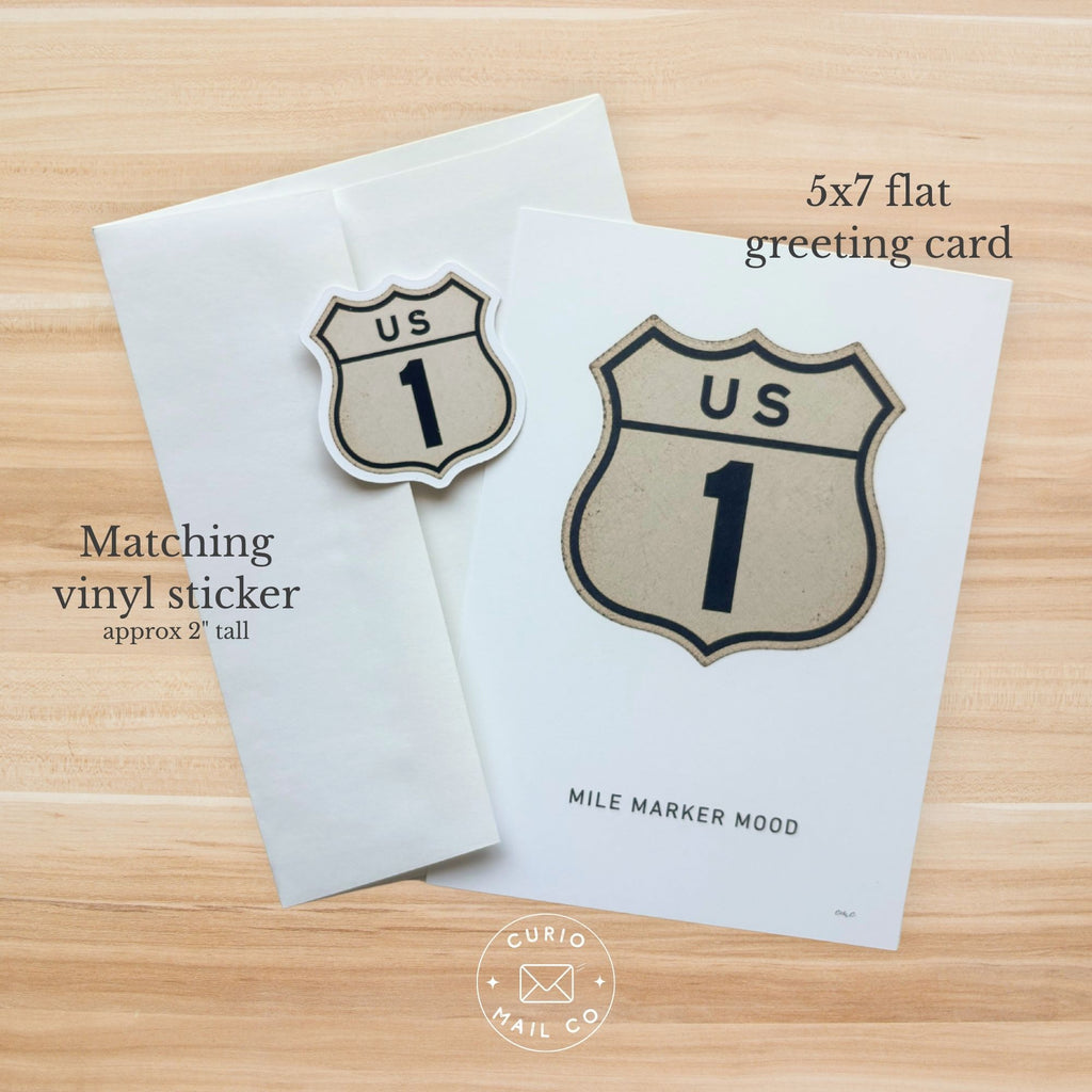 5x7 flat greeting card with matching vinyl sticker on a wooden surface, featuring 'US 1' design.