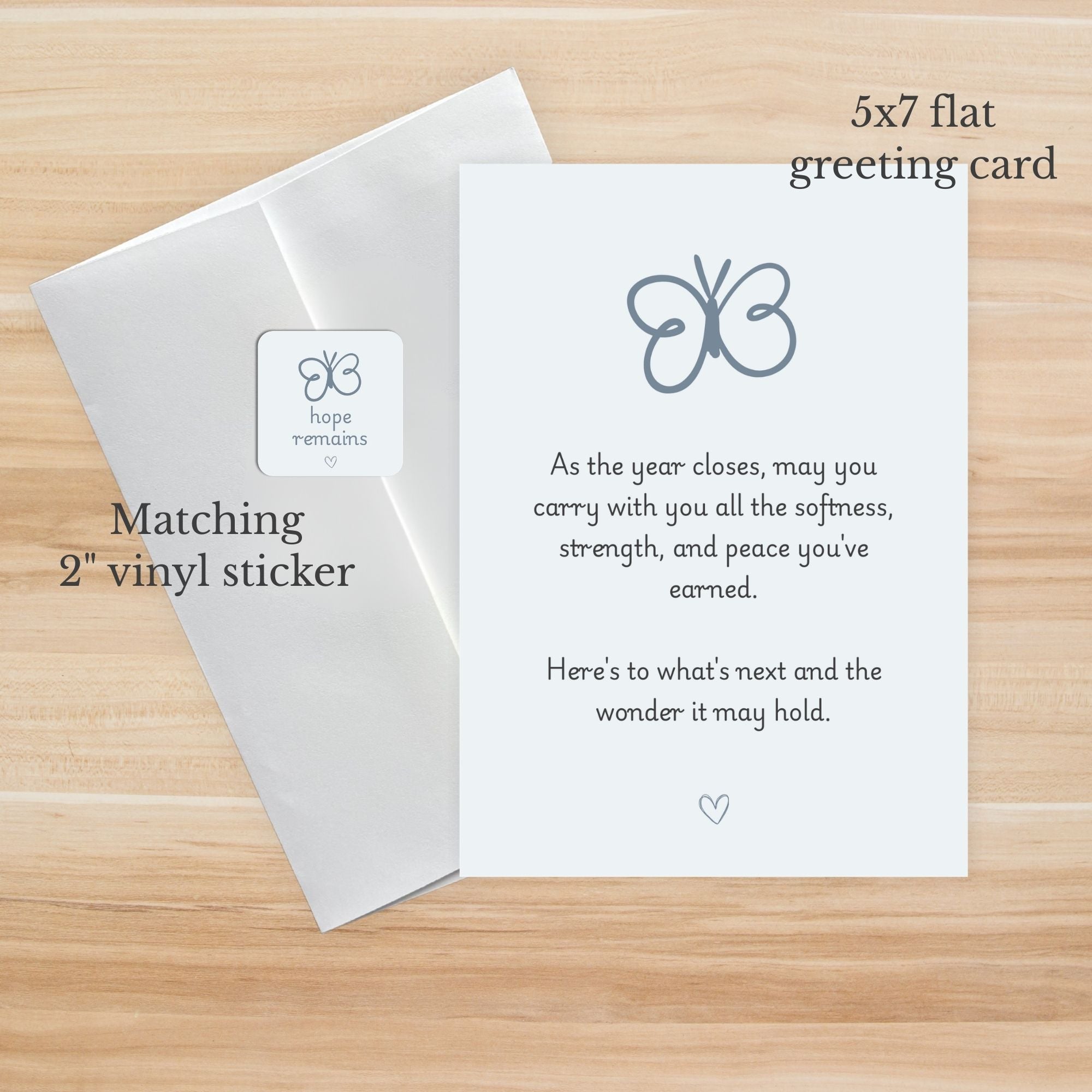 5x7 flat greeting card with matching 2" vinyl sticker on a wooden surface
