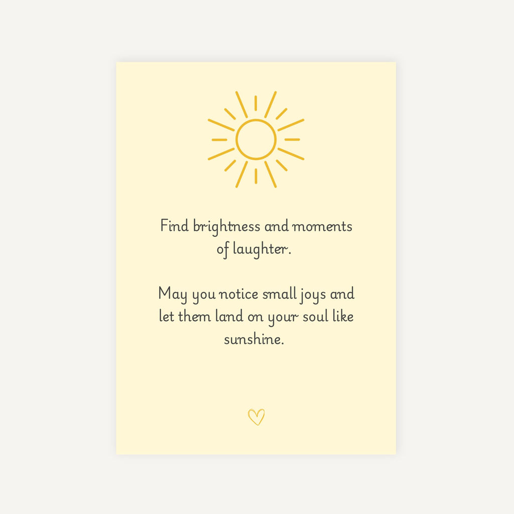 Motivational card with sun illustration and inspirational quote on a light yellow background