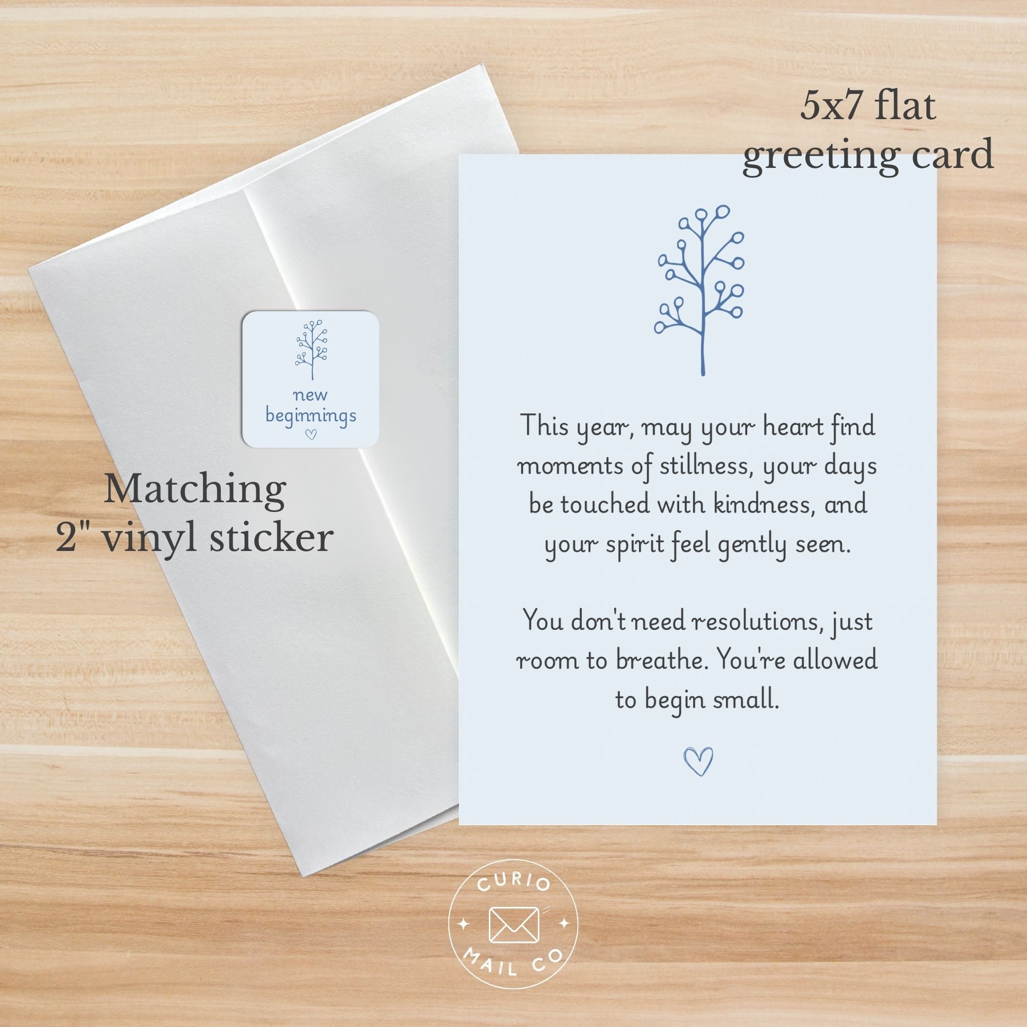 Greeting card with matching vinyl sticker on a wooden surface, featuring text and Curio Mail Co branding.