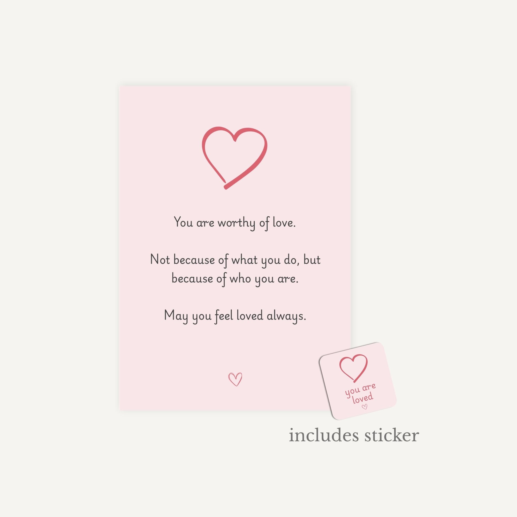 Motivational card with a heart design and inspirational message on a light pink background.
