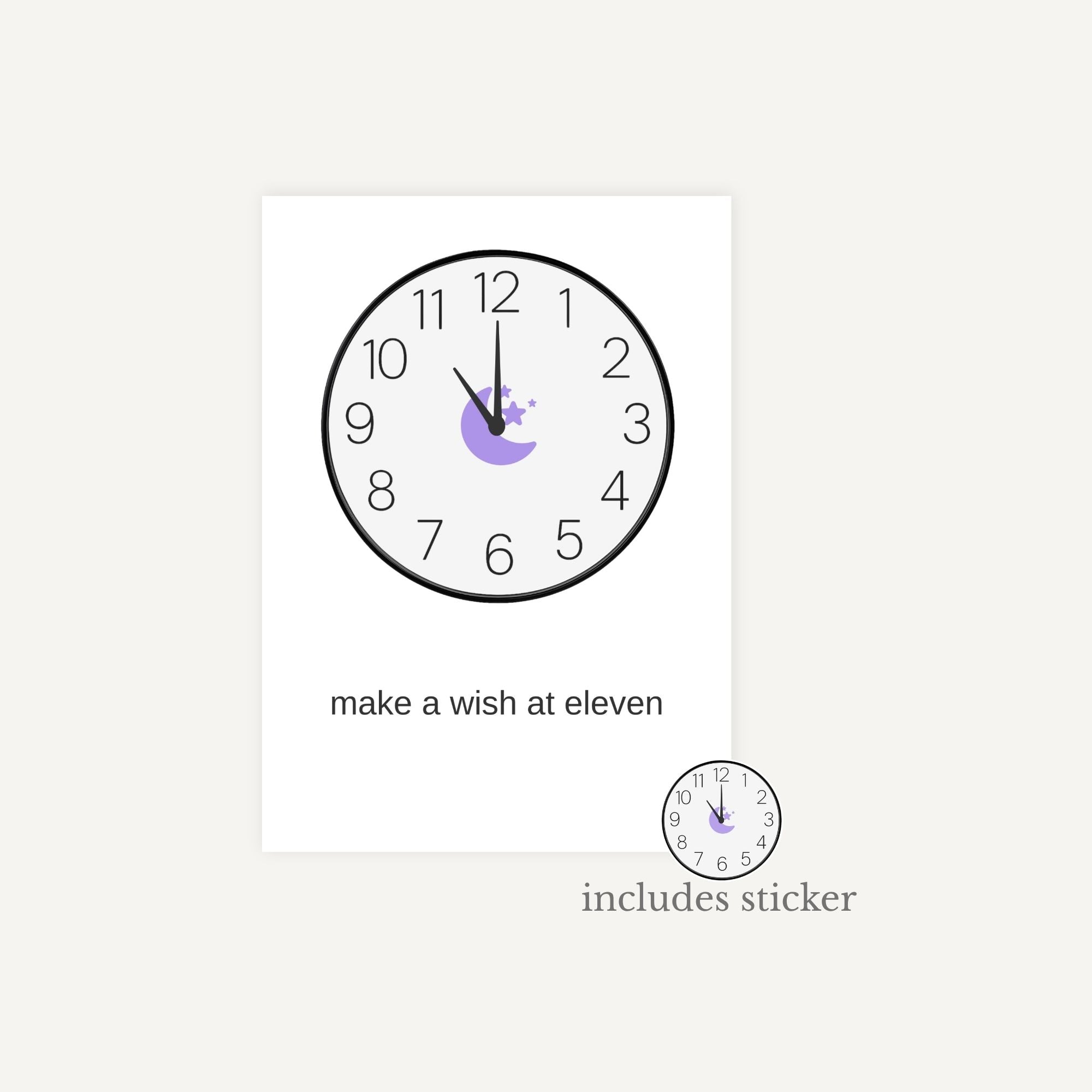 Wall clock with decorative sticker and text 'make a wish at eleven' on a white background
