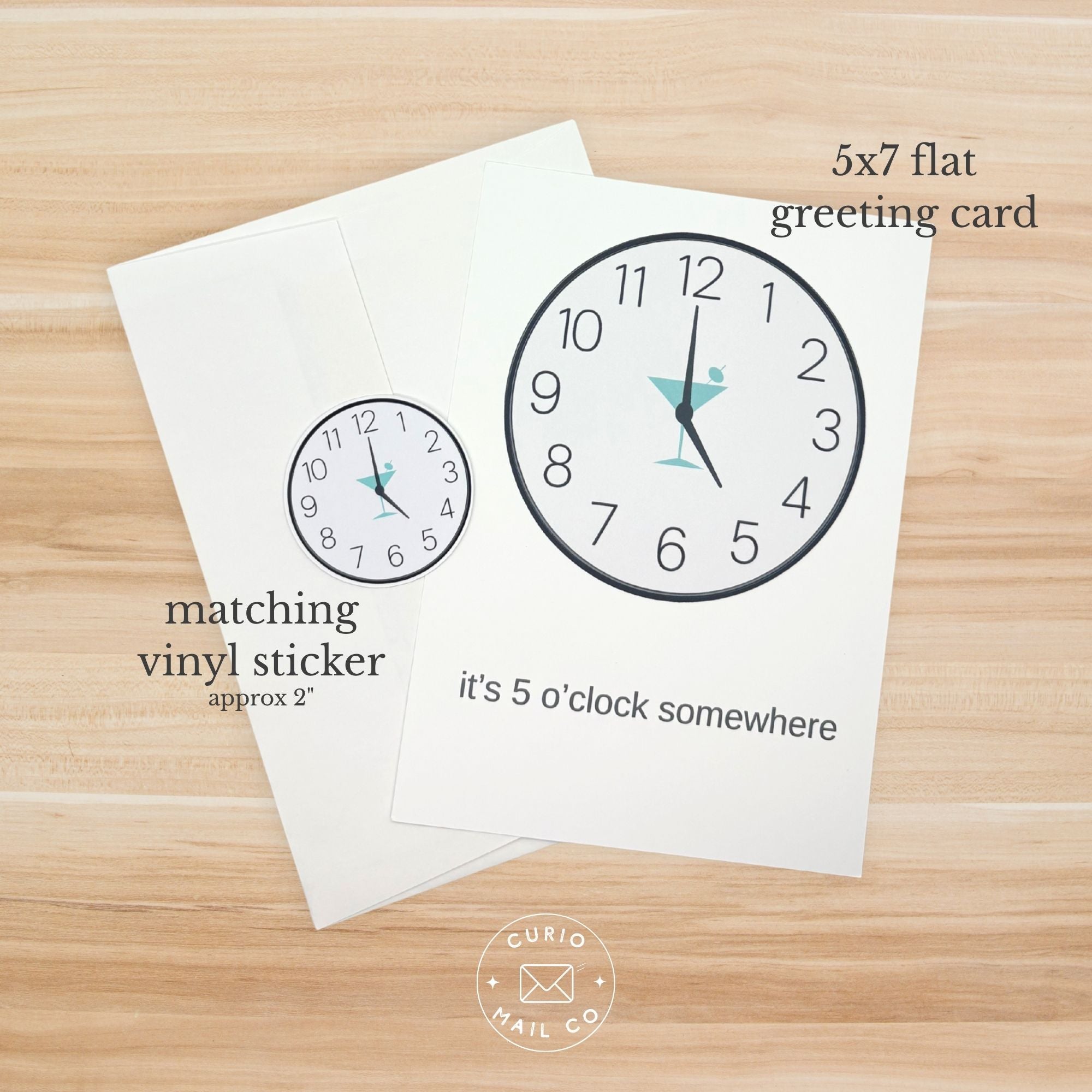 5x7 flat greeting card with clock design and matching vinyl sticker on a wooden surface, featuring 'Curio Mail Co' logo.
