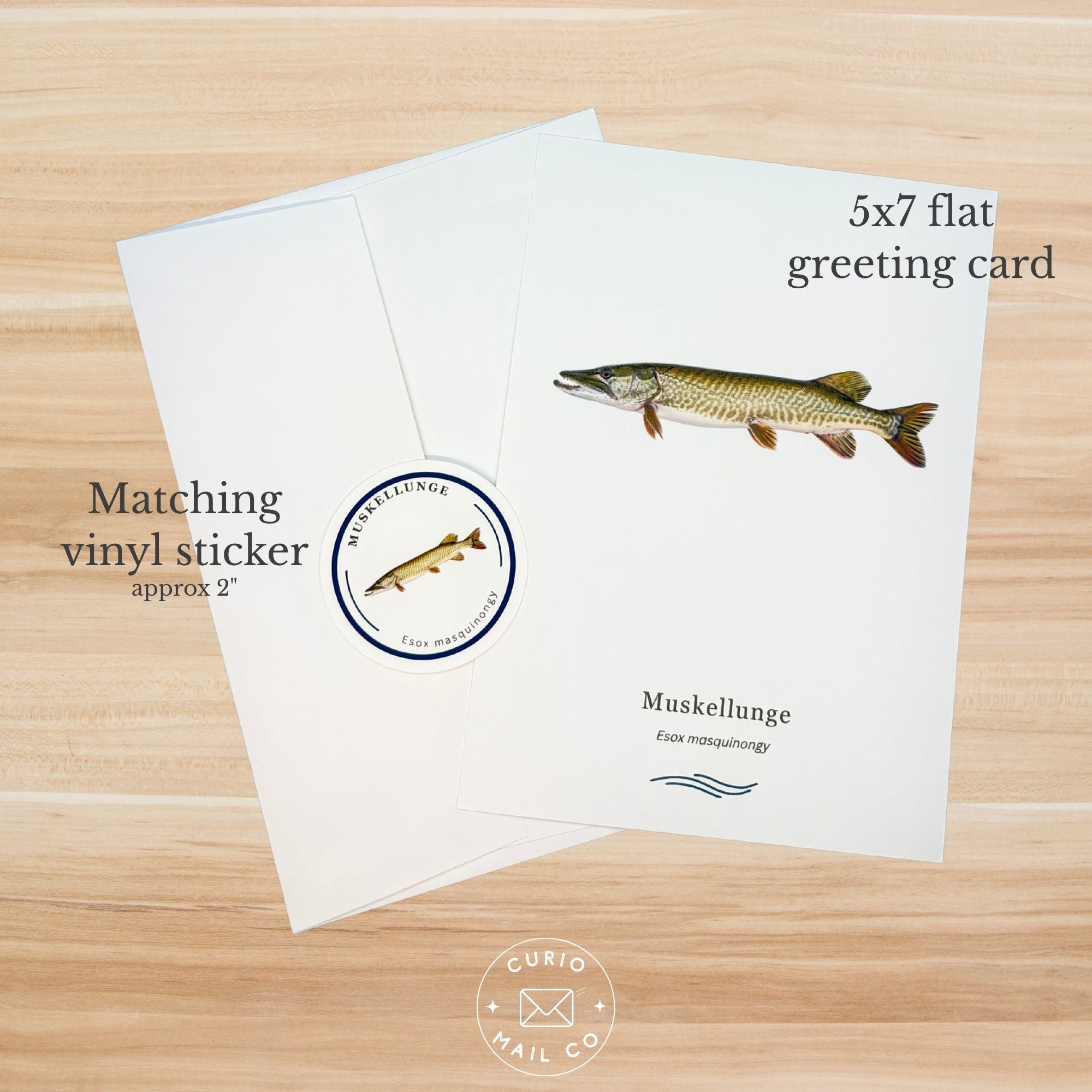 Greeting card with muskellunge illustration and matching vinyl sticker on a wooden surface