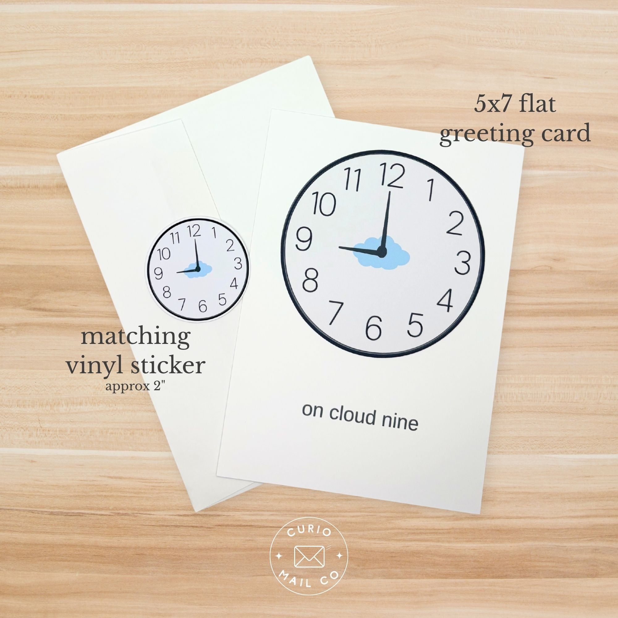 5x7 flat greeting card with clock design and matching vinyl sticker on a wooden surface, featuring 'Curio Mail Co' branding.