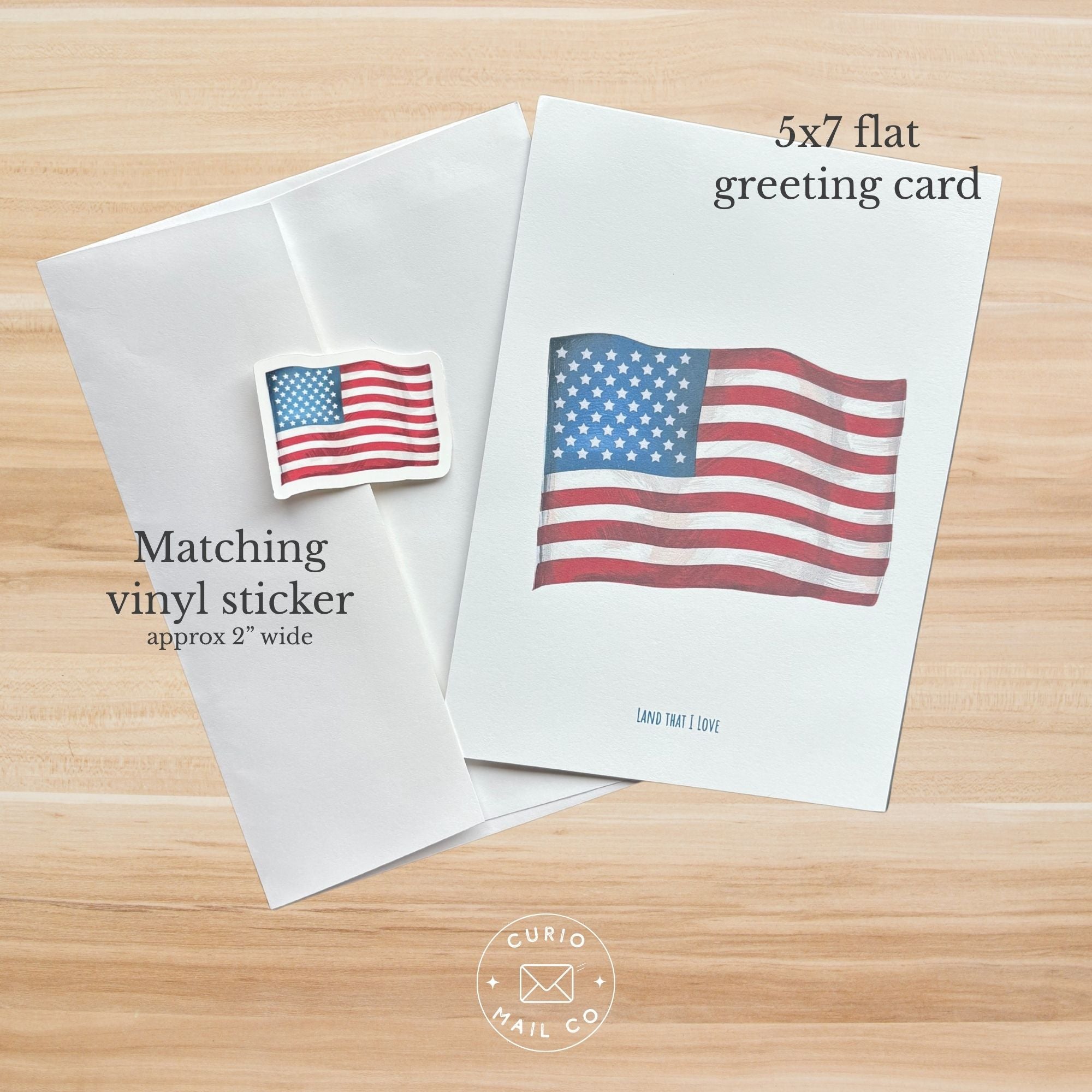 5x7 flat greeting card and matching vinyl sticker with American flag design on a wooden surface.