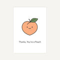 Card with a cartoon peach and text 'Thanks, You're a Peach' on a white background