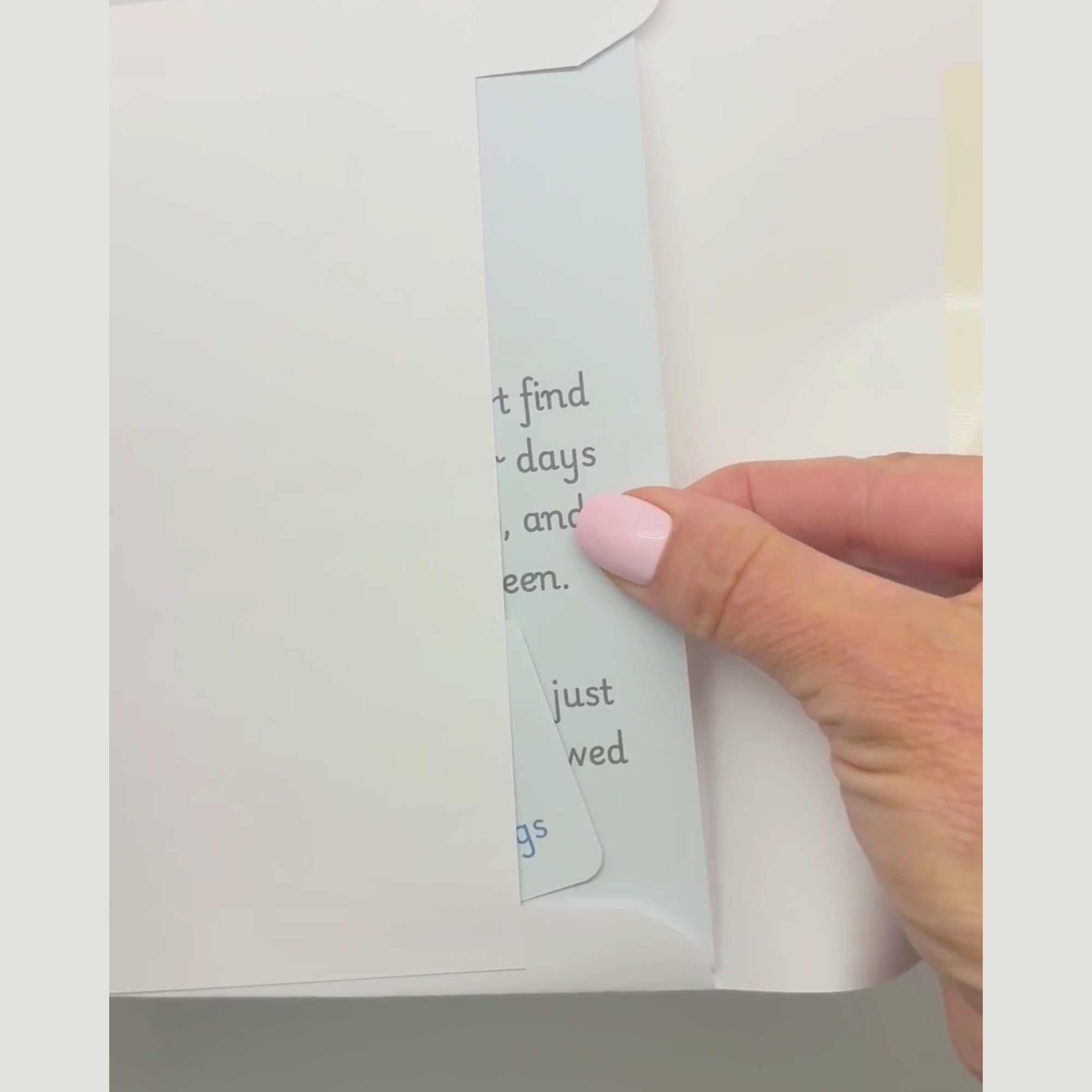 video showing a blessing card and sticker being pulled from an envelope