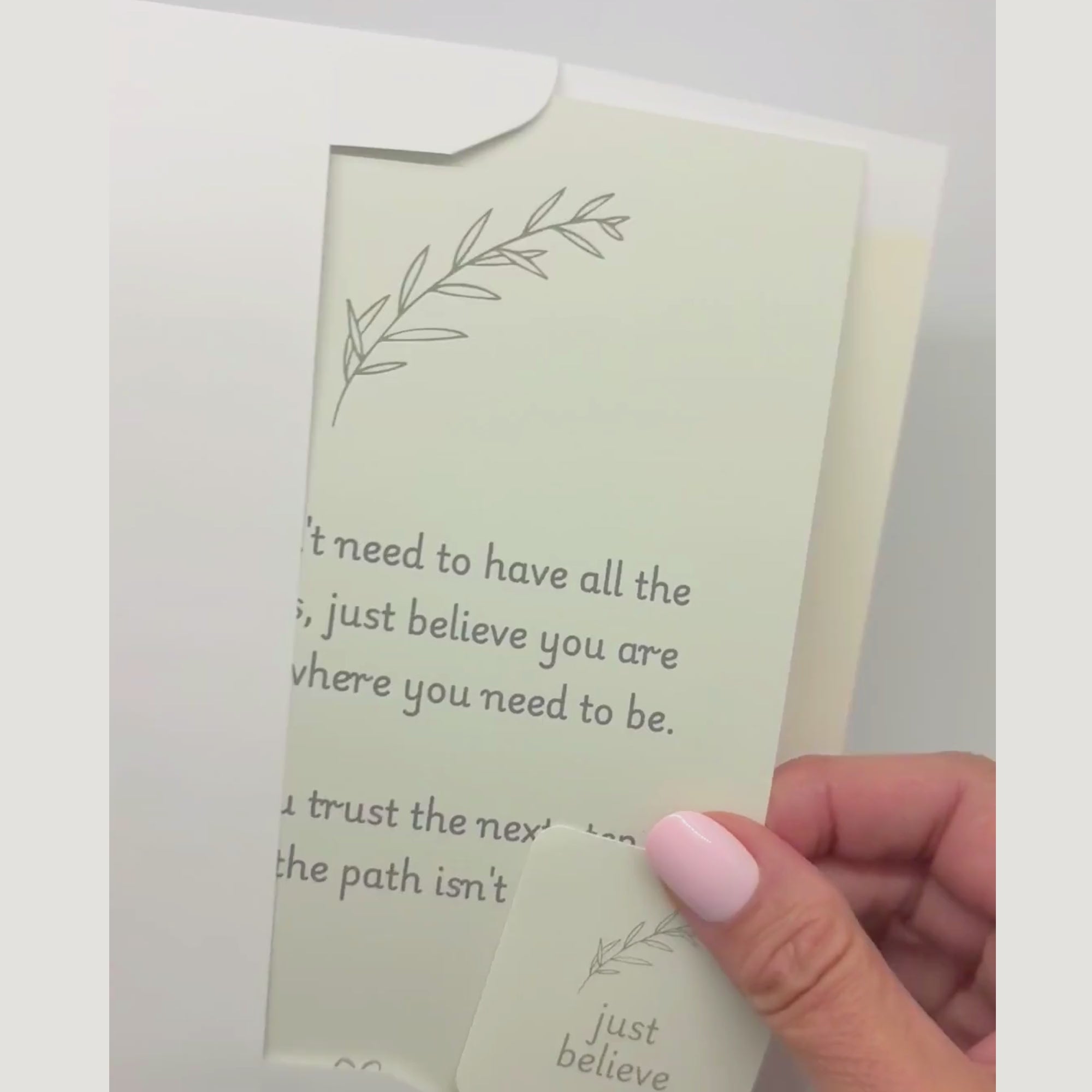 video showing a blessing card and sticker being pulled from an envelope