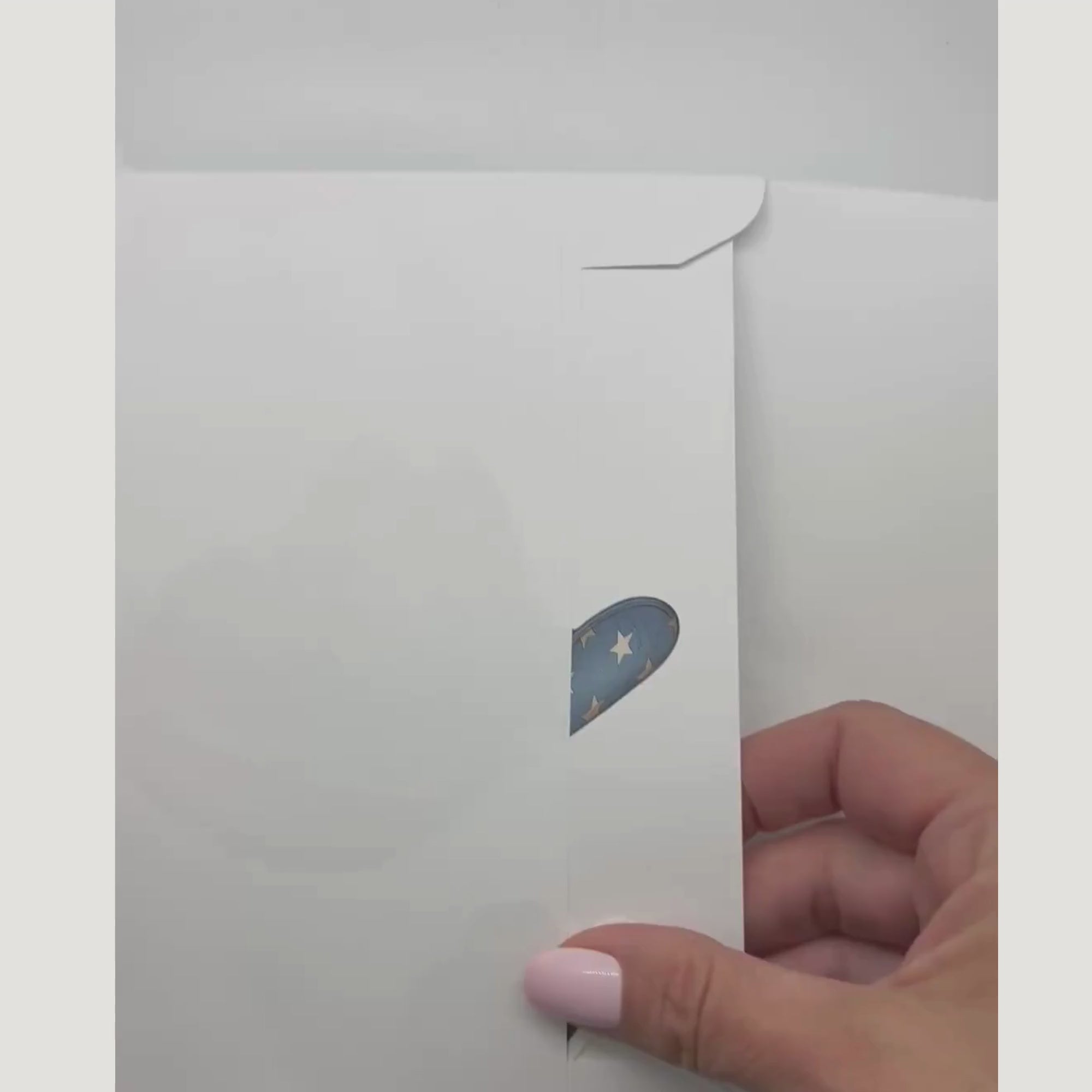video showing the patriotic card and sticker being removed from an envelope