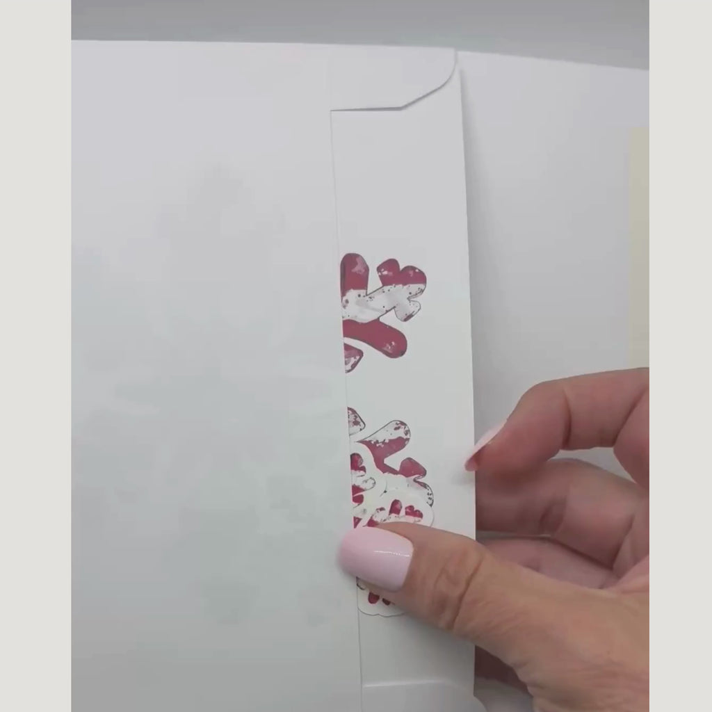 video showing the patriotic card and sticker being removed from an envelope