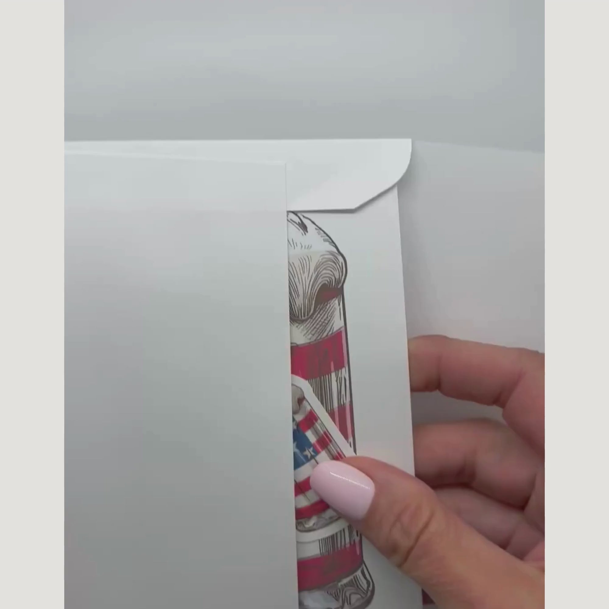 video showing the patriotic card and sticker being removed from an envelope