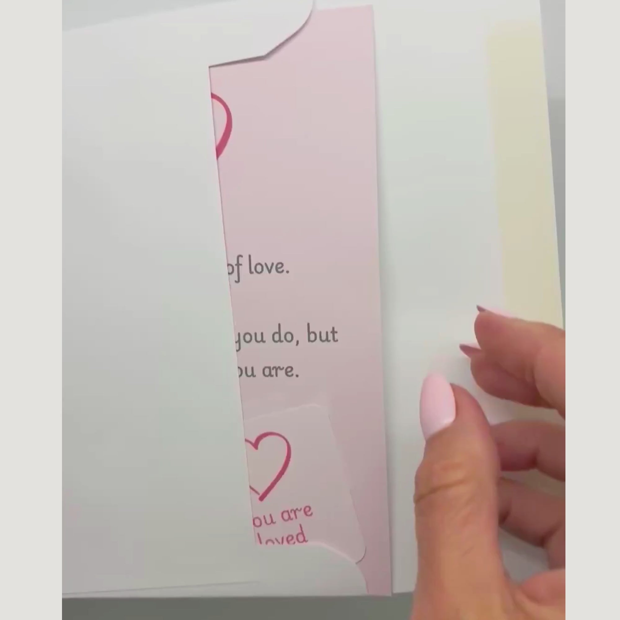 video showing a blessing card and sticker being pulled from an envelope