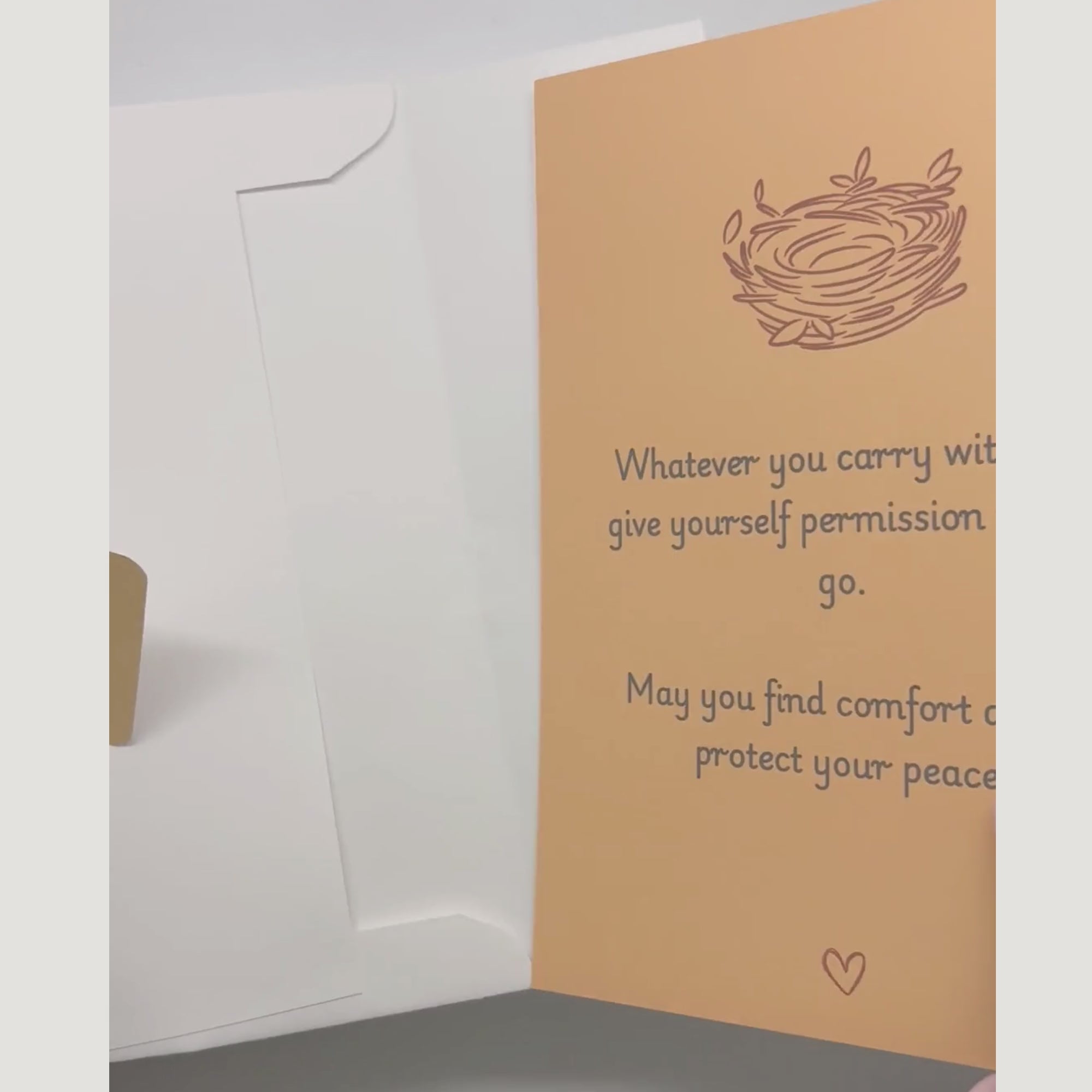 video showing a blessing card and sticker being pulled from an envelope