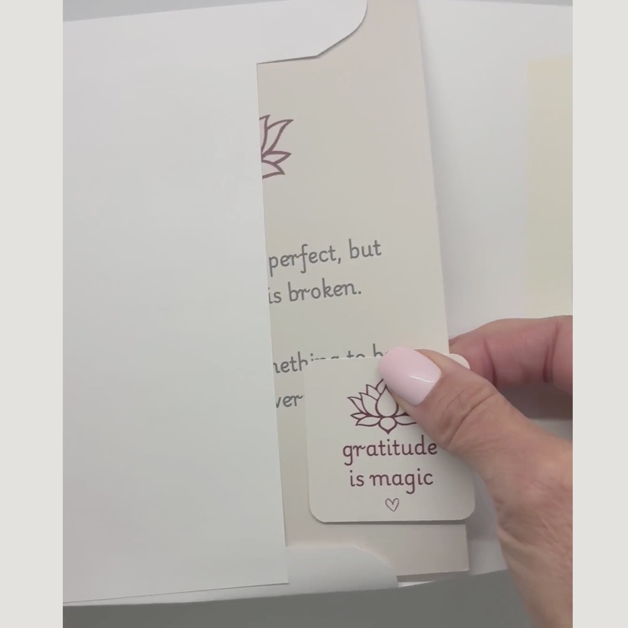 video showing a blessing card and sticker being pulled from an envelope
