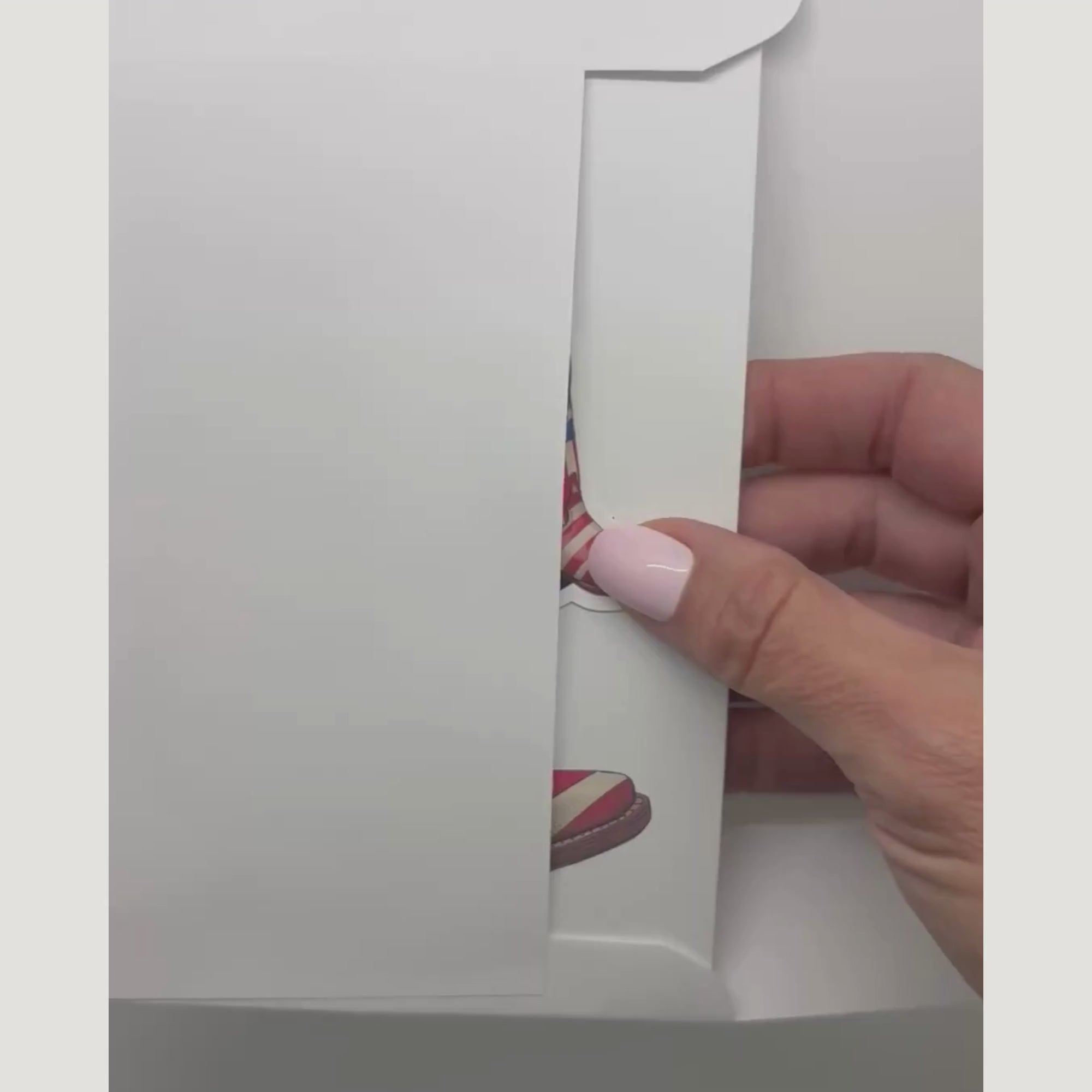 video showing the patriotic card and sticker being removed from an envelope