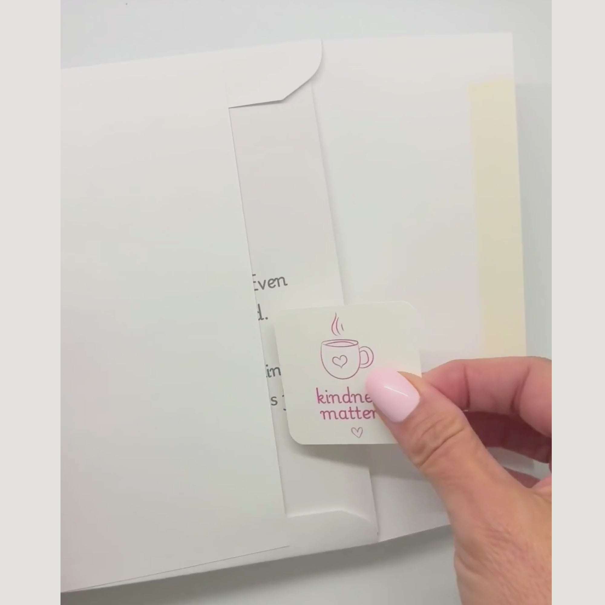 video showing a blessing card and sticker being pulled from an envelope