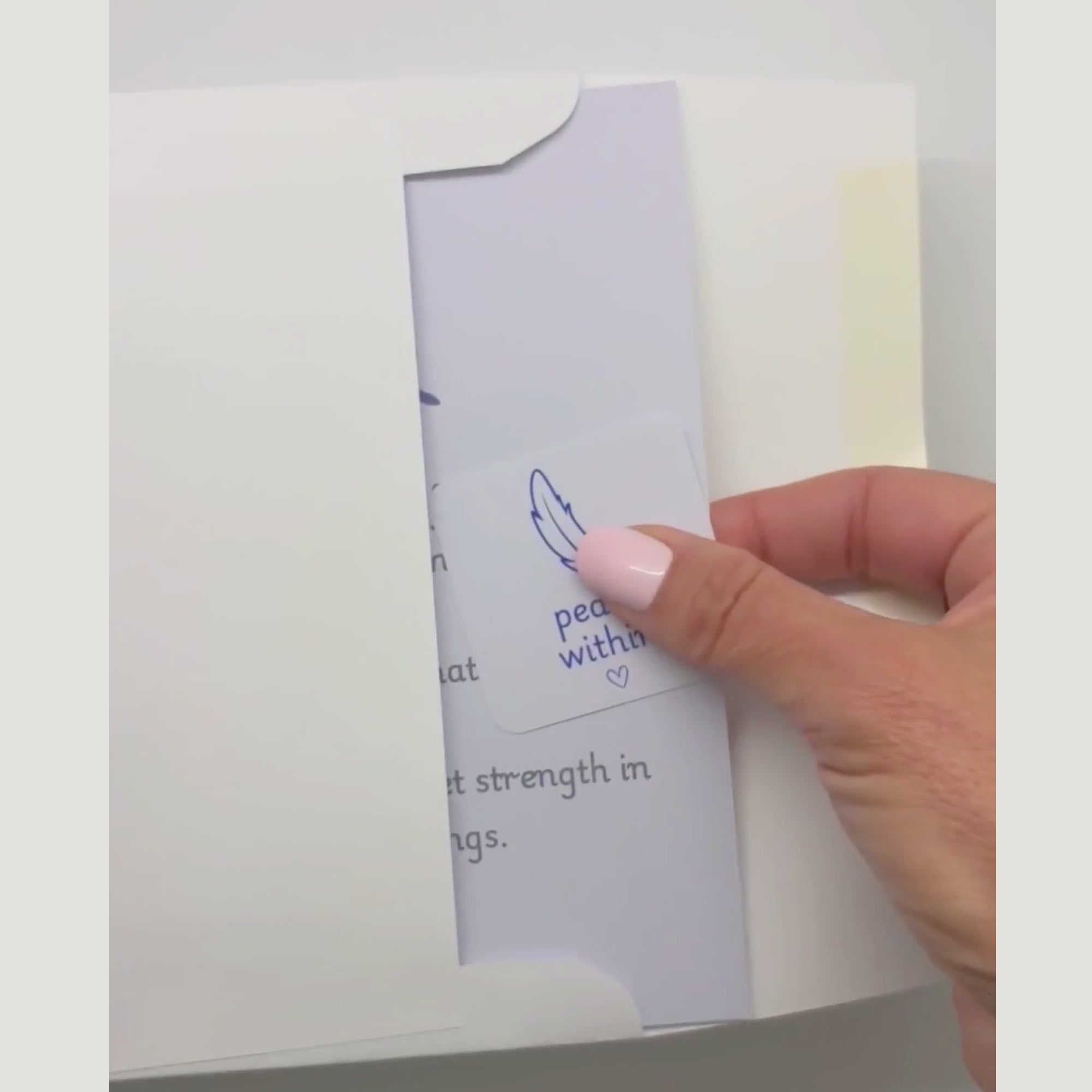 video showing a blessing card and sticker being pulled from an envelope