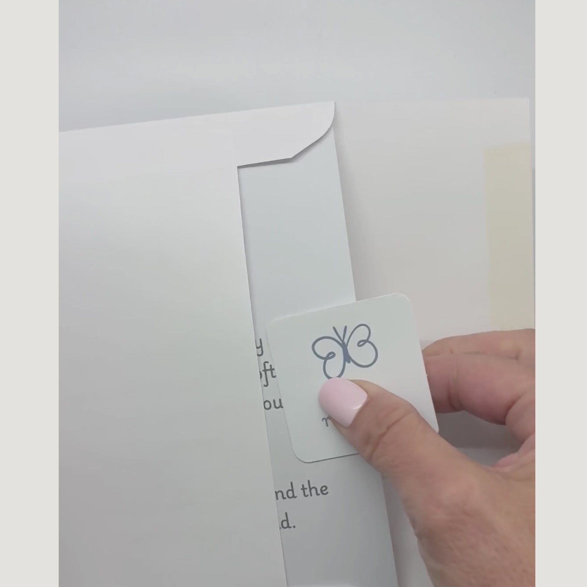 video showing a blessing card and sticker being pulled from an envelope