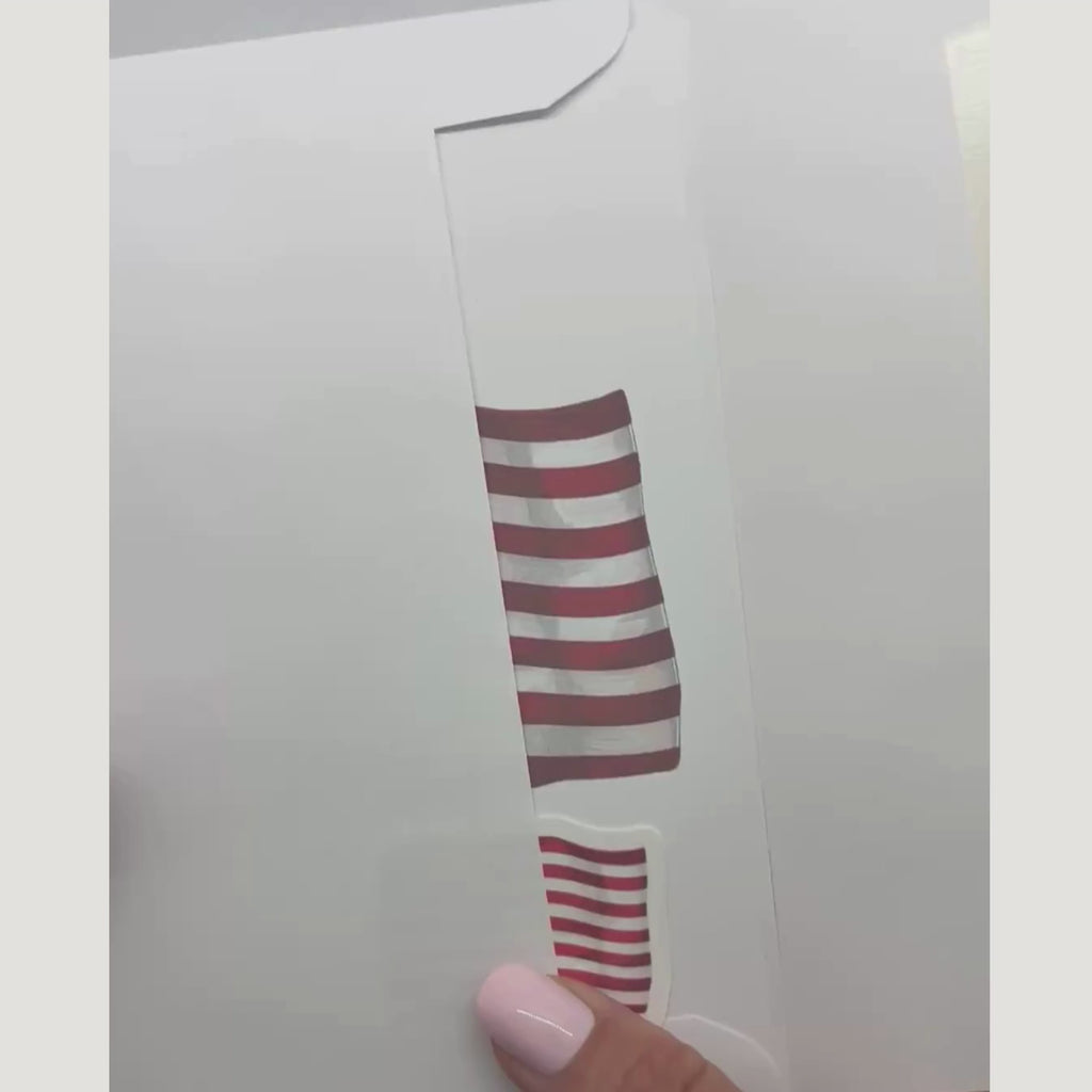 video showing the patriotic card and sticker being removed from an envelope