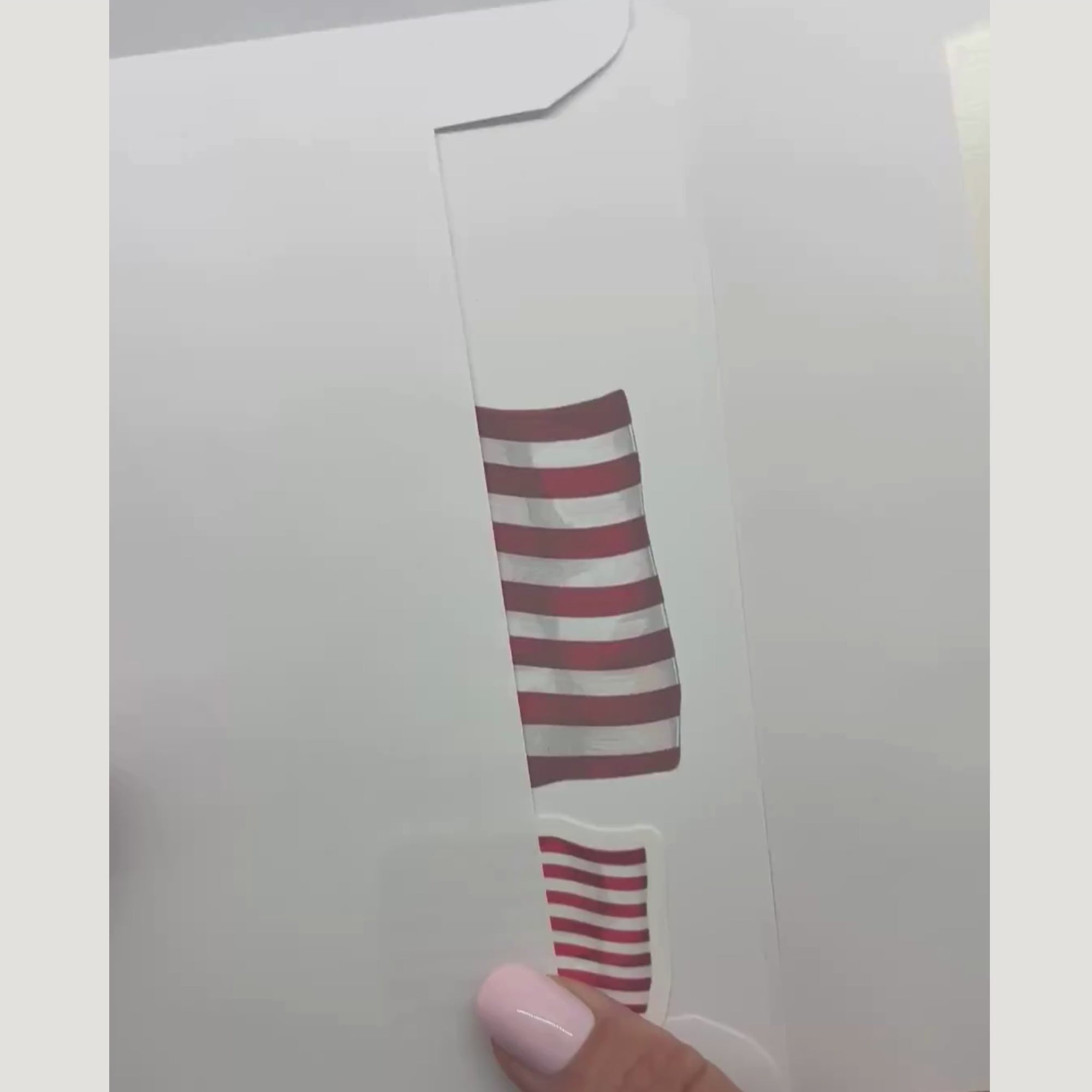 video showing the patriotic card and sticker being removed from an envelope