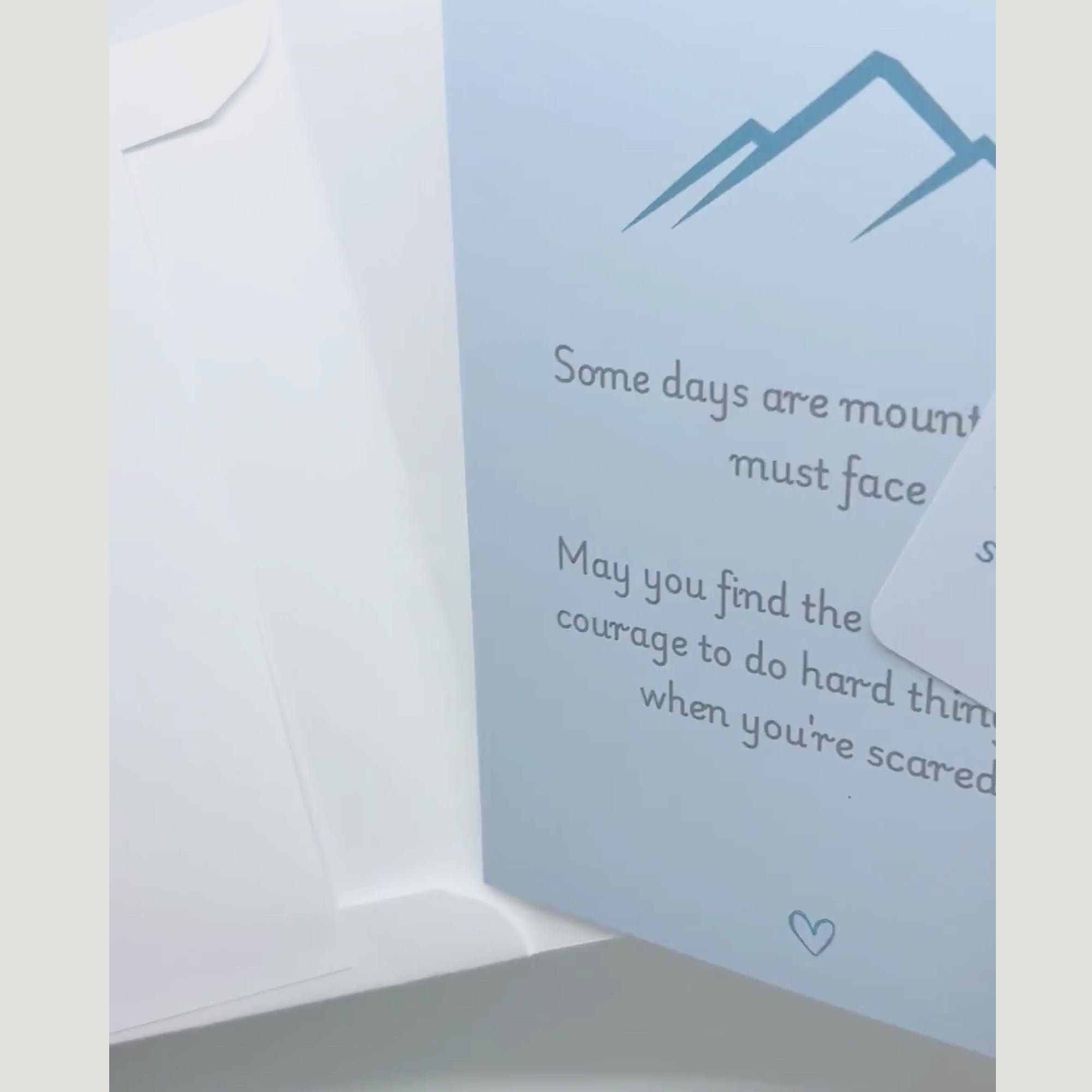 video showing a blessing card and sticker being pulled from an envelope