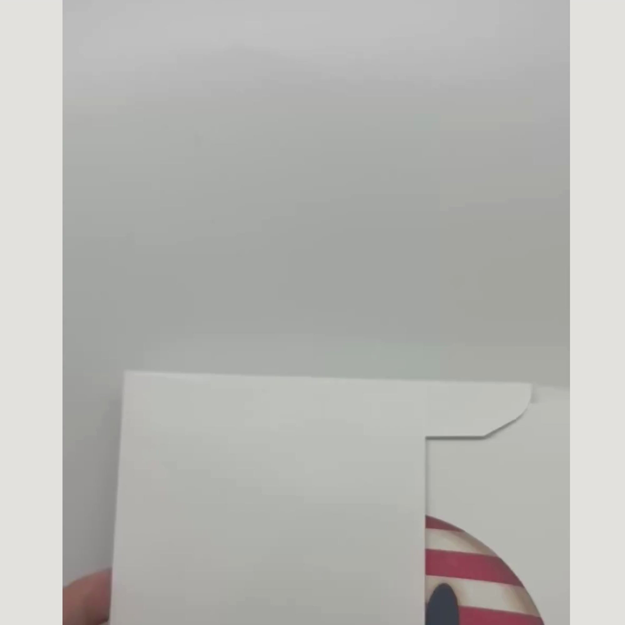 video showing the patriotic card and sticker being removed from an envelope