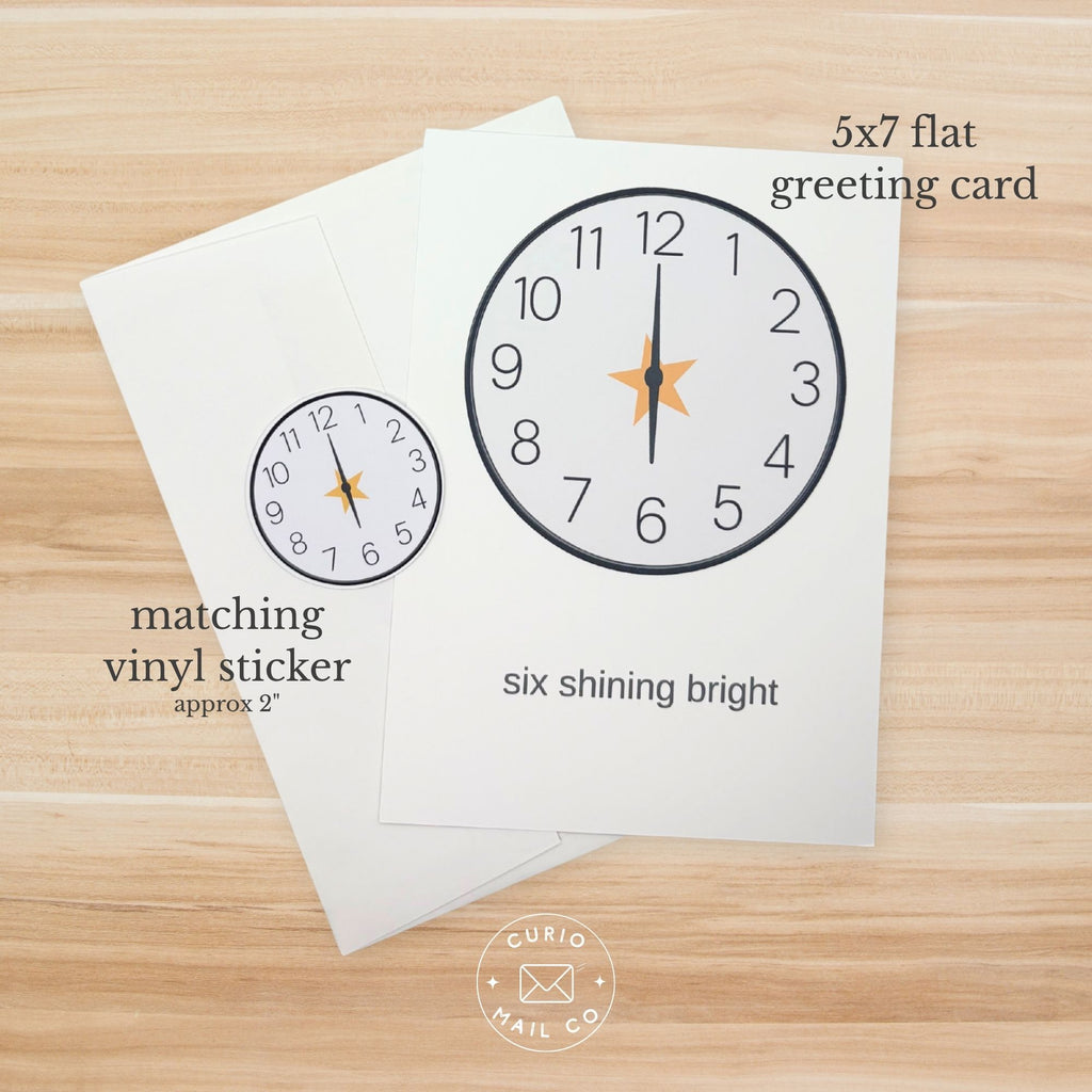 5x7 flat greeting card with clock design on a wooden surface, featuring matching vinyl sticker text.