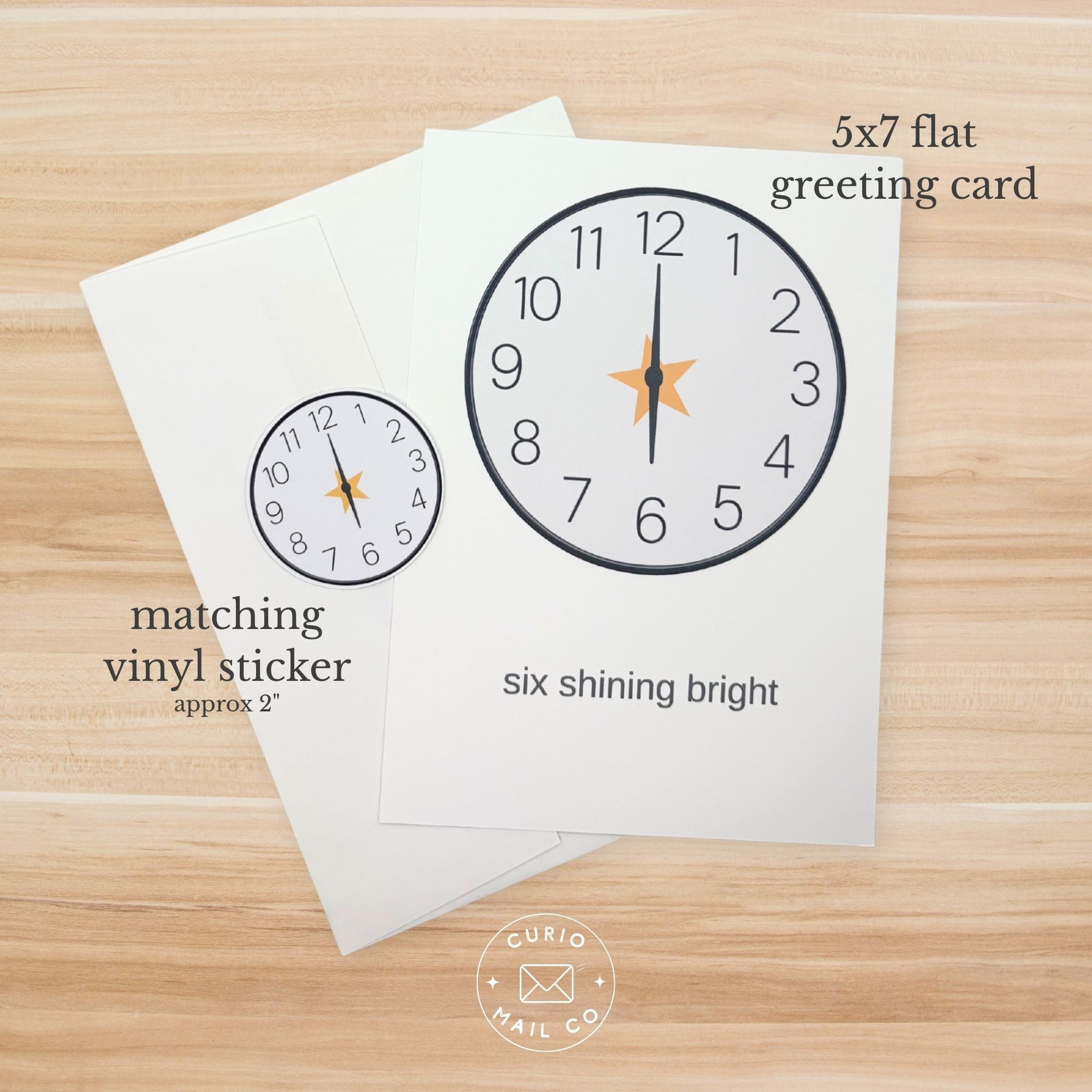 5x7 flat greeting card with clock design on a wooden surface, featuring matching vinyl sticker text.