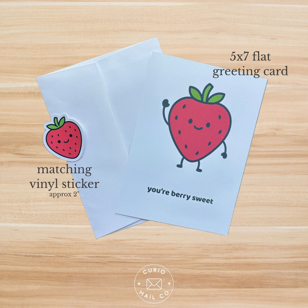 5x7 flat greeting card with strawberry design on a wooden surface, featuring 'Curio Mail Co' branding.